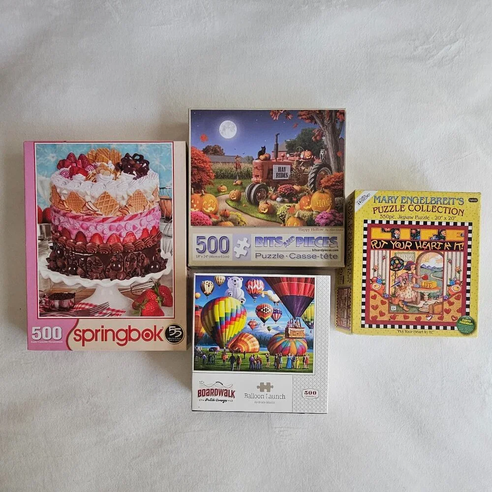 Four different jigsaw puzzles - Picture 1 of 6